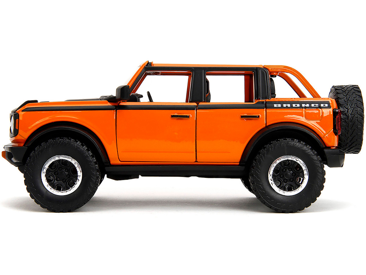 2021 Ford Bronco Open-Top Orange with Black Stripes and Hood with Extra Wheels "Just Trucks" Series 1/24 by Jada