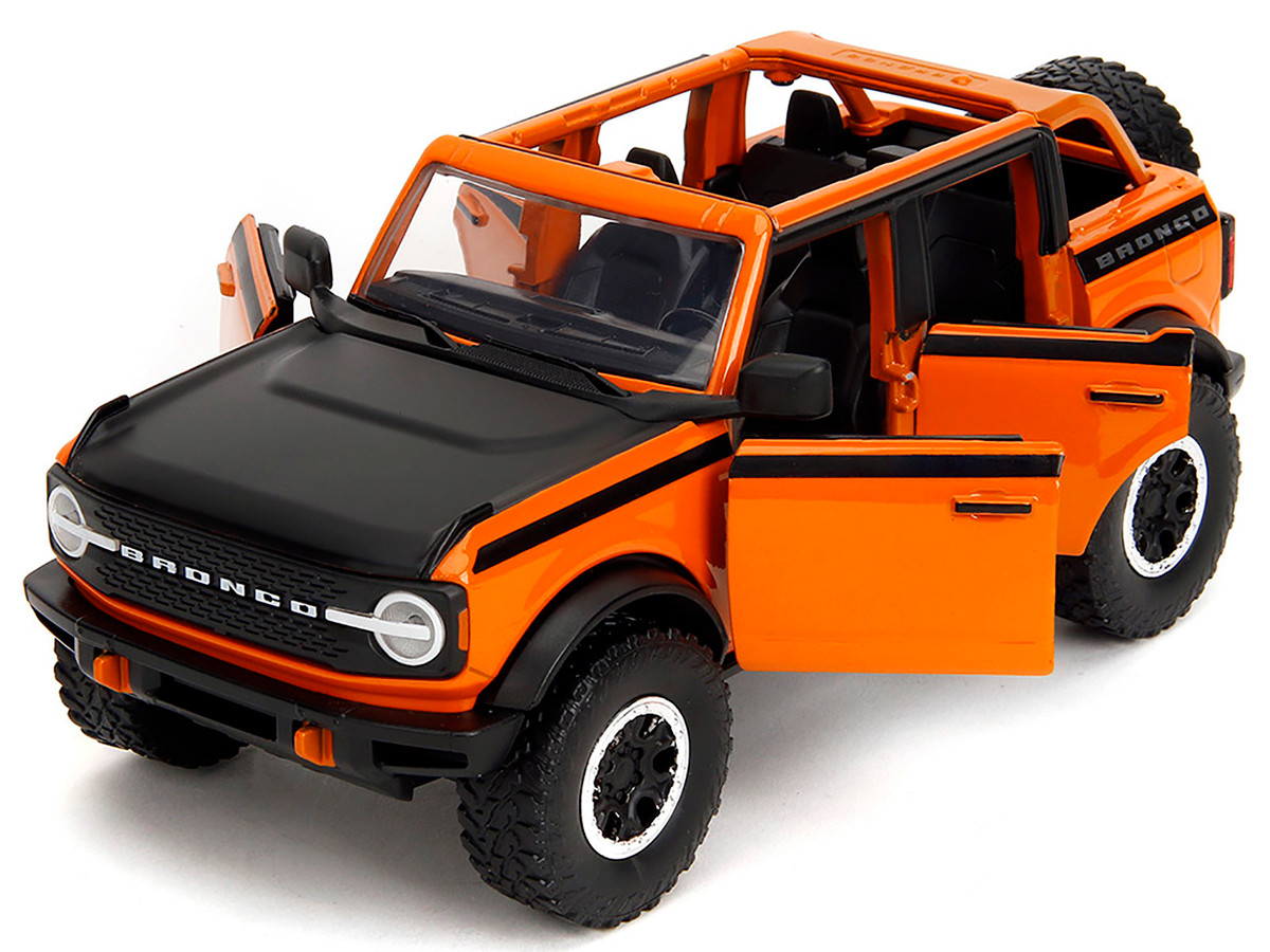 2021 Ford Bronco Open-Top Orange with Black Stripes and Hood with Extra Wheels "Just Trucks" Series 1/24 by Jada - Image 2